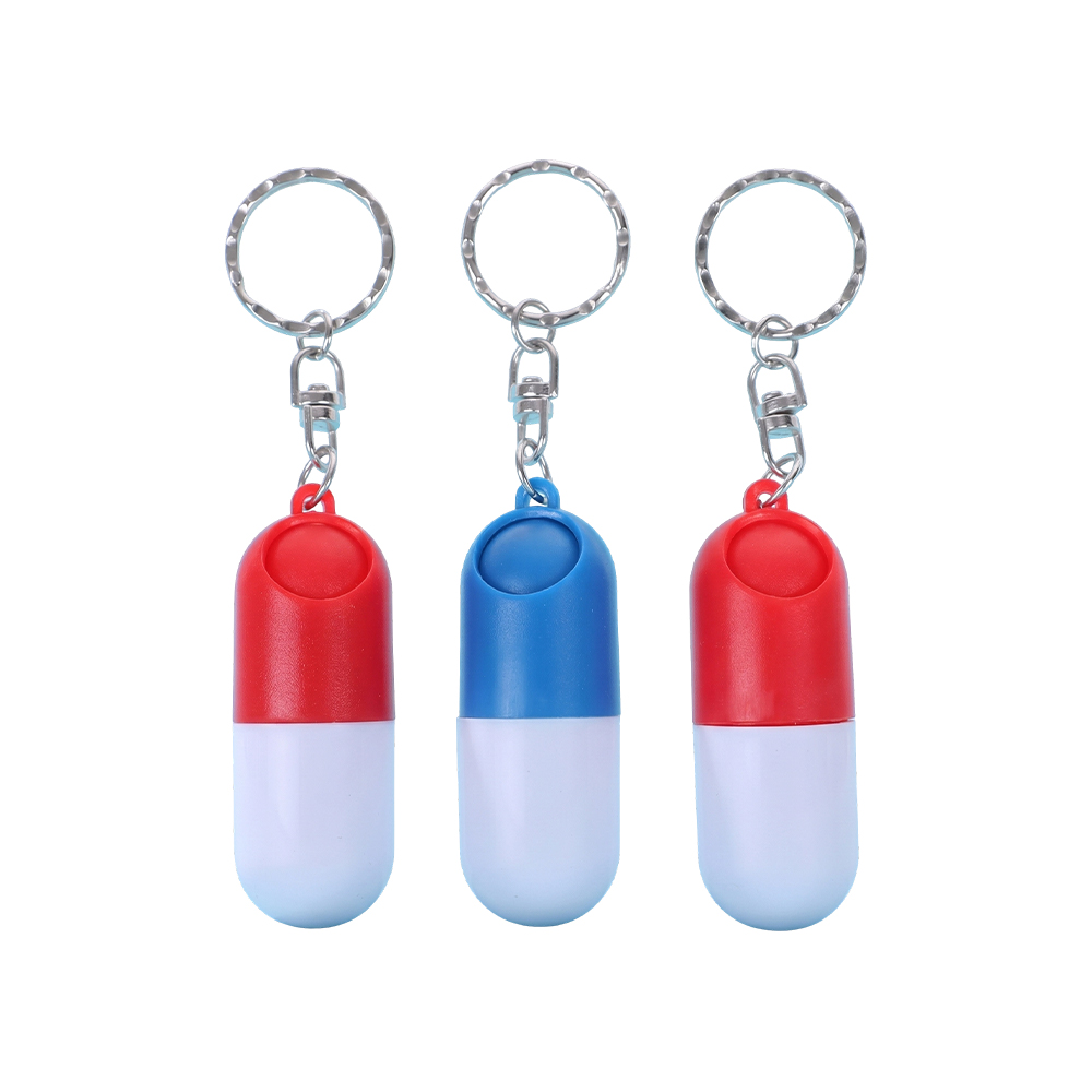 Pastillero con llavero en forma de cápsula